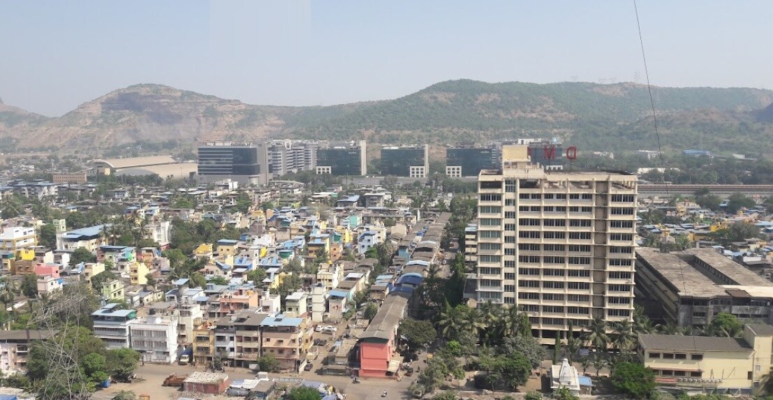 Airoli Sector 3_a city with tall buildings and a sky background